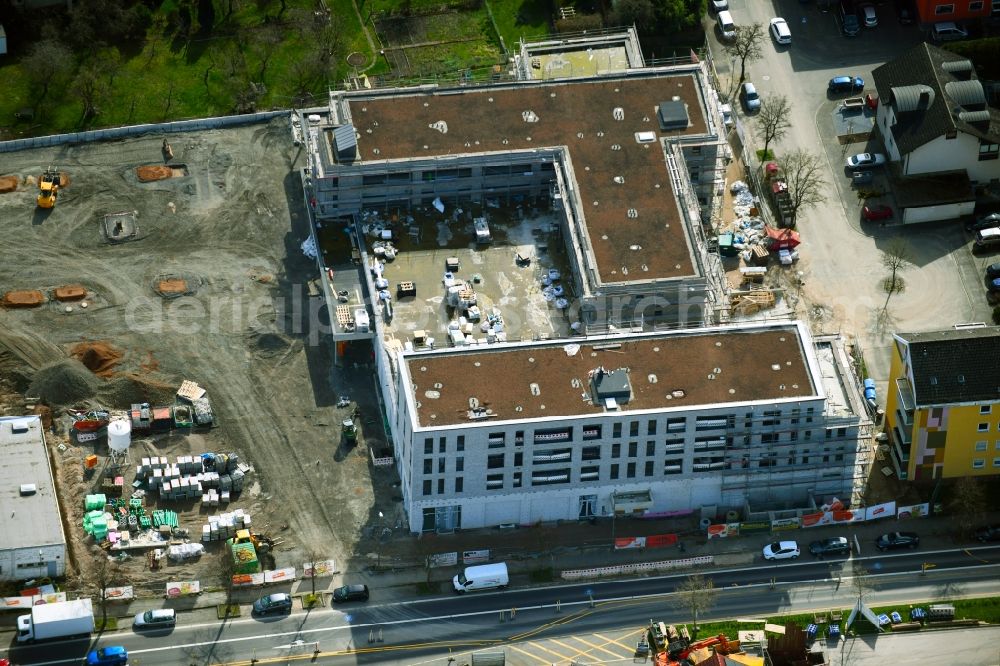 Aerial photograph Aschaffenburg - New construction of the building complex of the shopping center Tegut-Markt on Schillerstrasse corner Muellerstrasse in the district Damm in Aschaffenburg in the state Bavaria, Germany