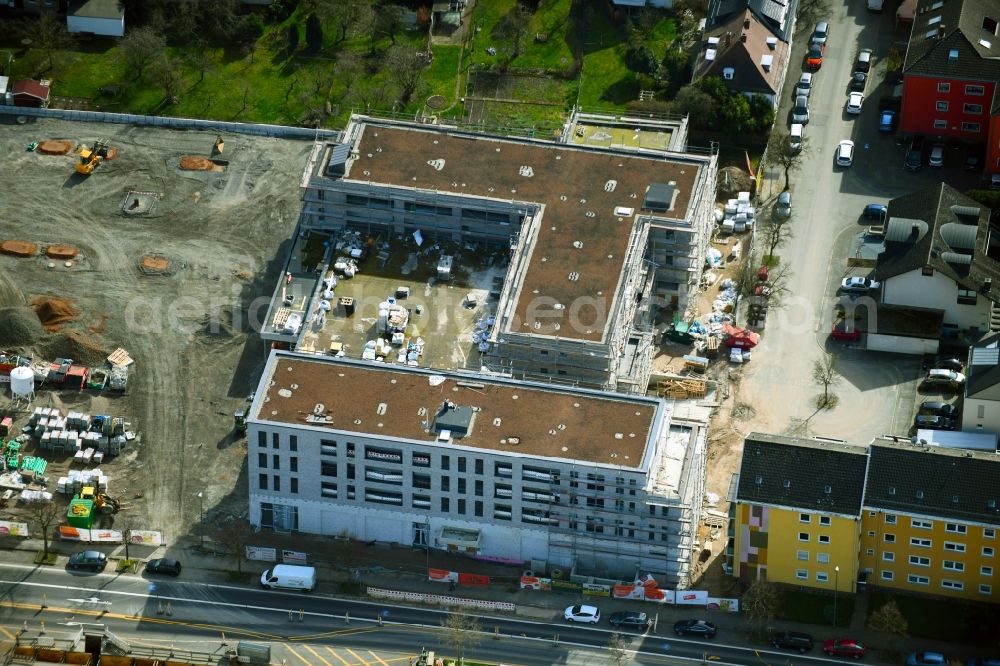 Aschaffenburg from the bird's eye view: New construction of the building complex of the shopping center Tegut-Markt on Schillerstrasse corner Muellerstrasse in the district Damm in Aschaffenburg in the state Bavaria, Germany