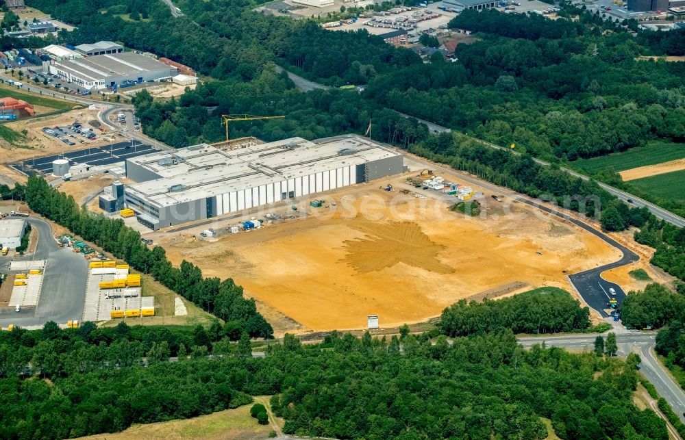 Dorsten from the bird's eye view: Construction site to build a new building complex on the site of the logistics center arvato of Bertelsmann SE & Co. KGaA along the Buerer Strasse to the Hervester Strasse in Dorsten in the state North Rhine-Westphalia, Germany