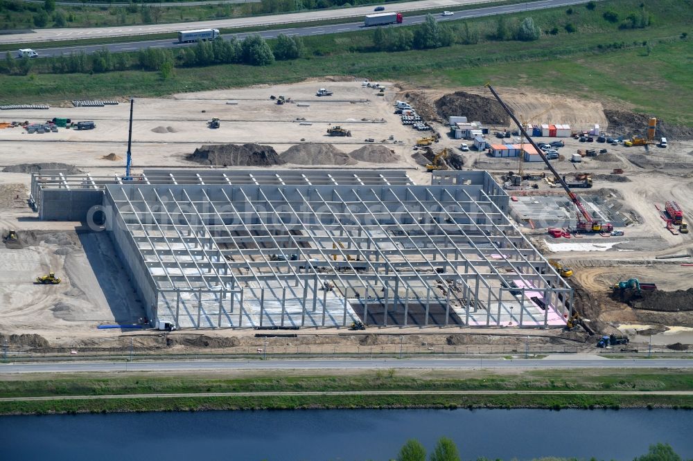 Aerial photograph Wustermark - Construction site to build a new building complex on the site of the logistics center of Brueof Schlau GmbH & Co. KG in Wustermark in the state Brandenburg, Germany