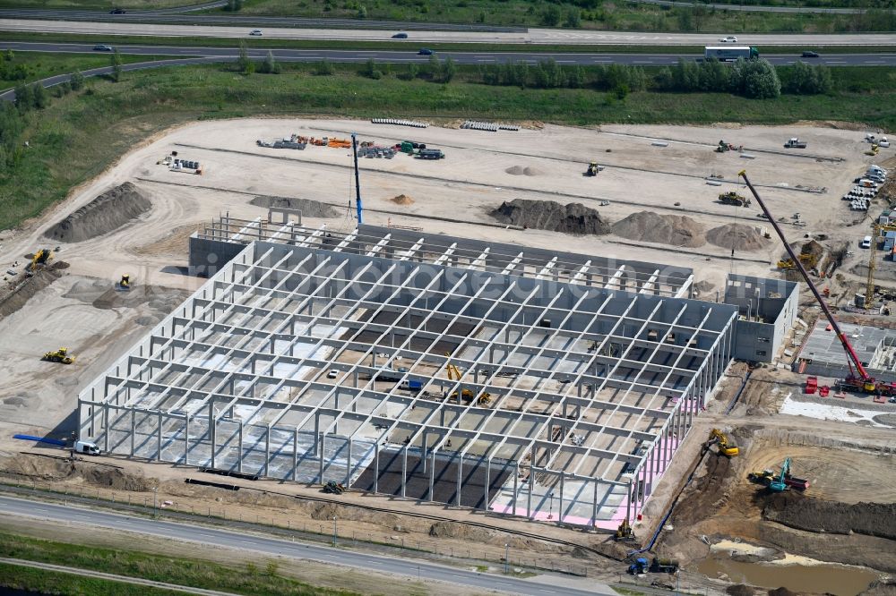 Wustermark from the bird's eye view: Construction site to build a new building complex on the site of the logistics center of Brueof Schlau GmbH & Co. KG in Wustermark in the state Brandenburg, Germany