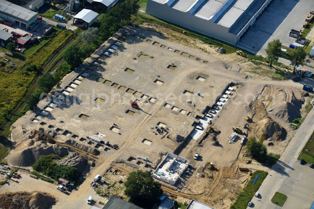 Hoppegarten from the bird's eye view: Construction site to build a new building complex on the site of the logistics center of Rhenus Home Delivery GmbH in the district Dahlwitz-Hoppegarten in Hoppegarten in the state Brandenburg, Germany