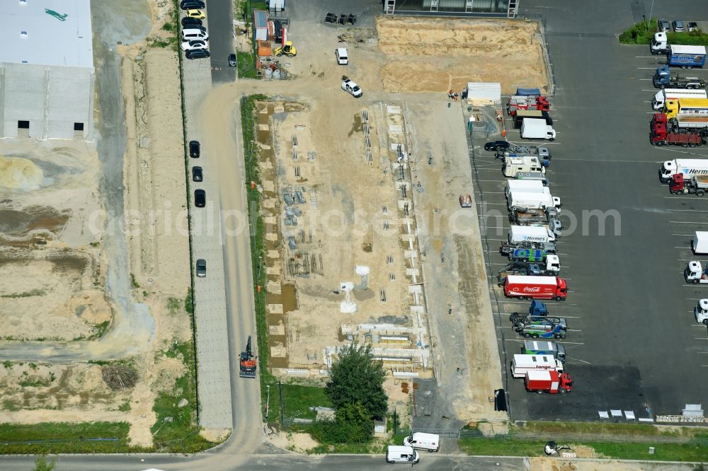 Hoppegarten from the bird's eye view: Construction site to build a new building complex on the site of the logistics center of Rhenus Home Delivery GmbH in the district Dahlwitz-Hoppegarten in Hoppegarten in the state Brandenburg, Germany