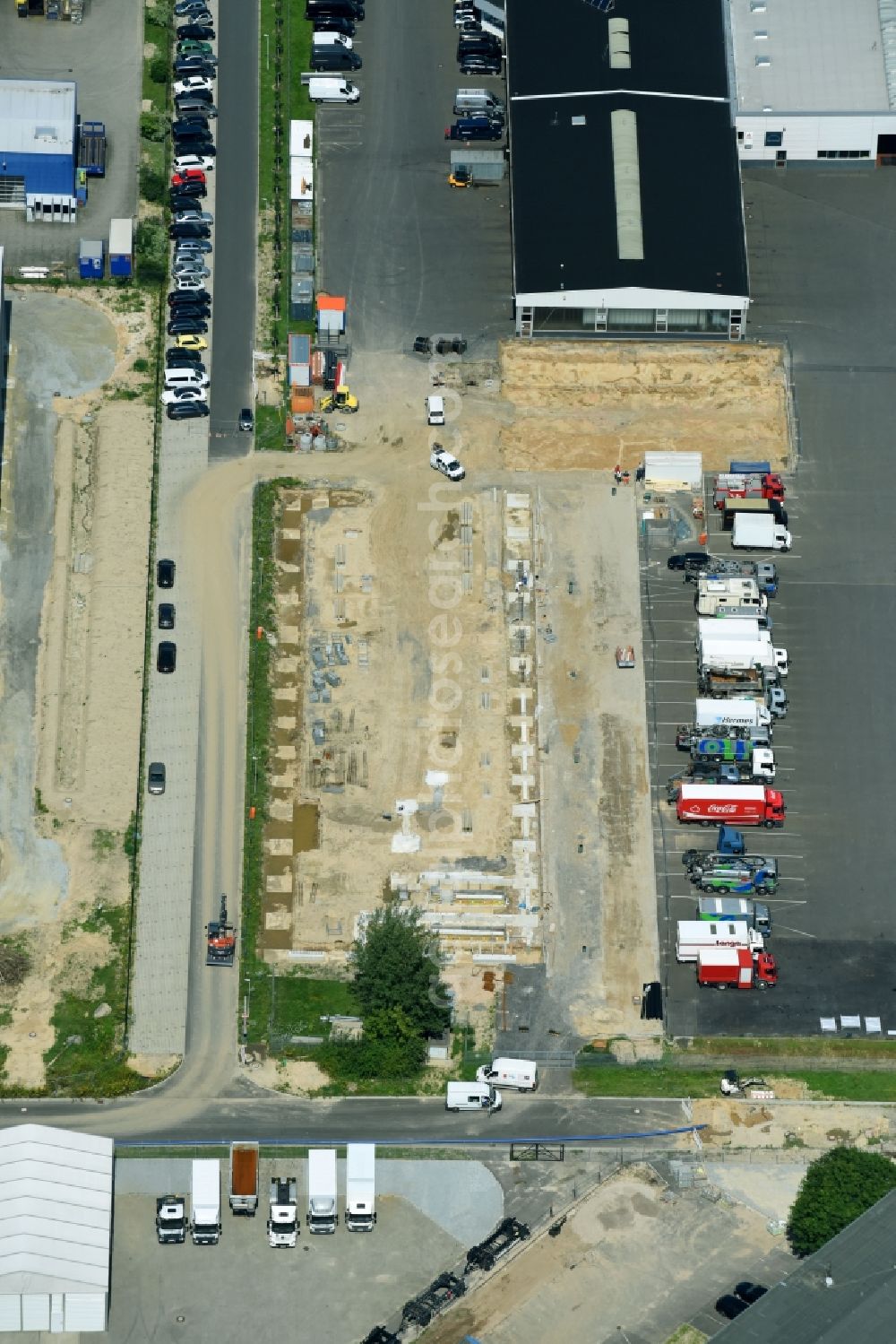 Aerial image Hoppegarten - Construction site to build a new building complex on the site of the logistics center of Rhenus Home Delivery GmbH in the district Dahlwitz-Hoppegarten in Hoppegarten in the state Brandenburg, Germany