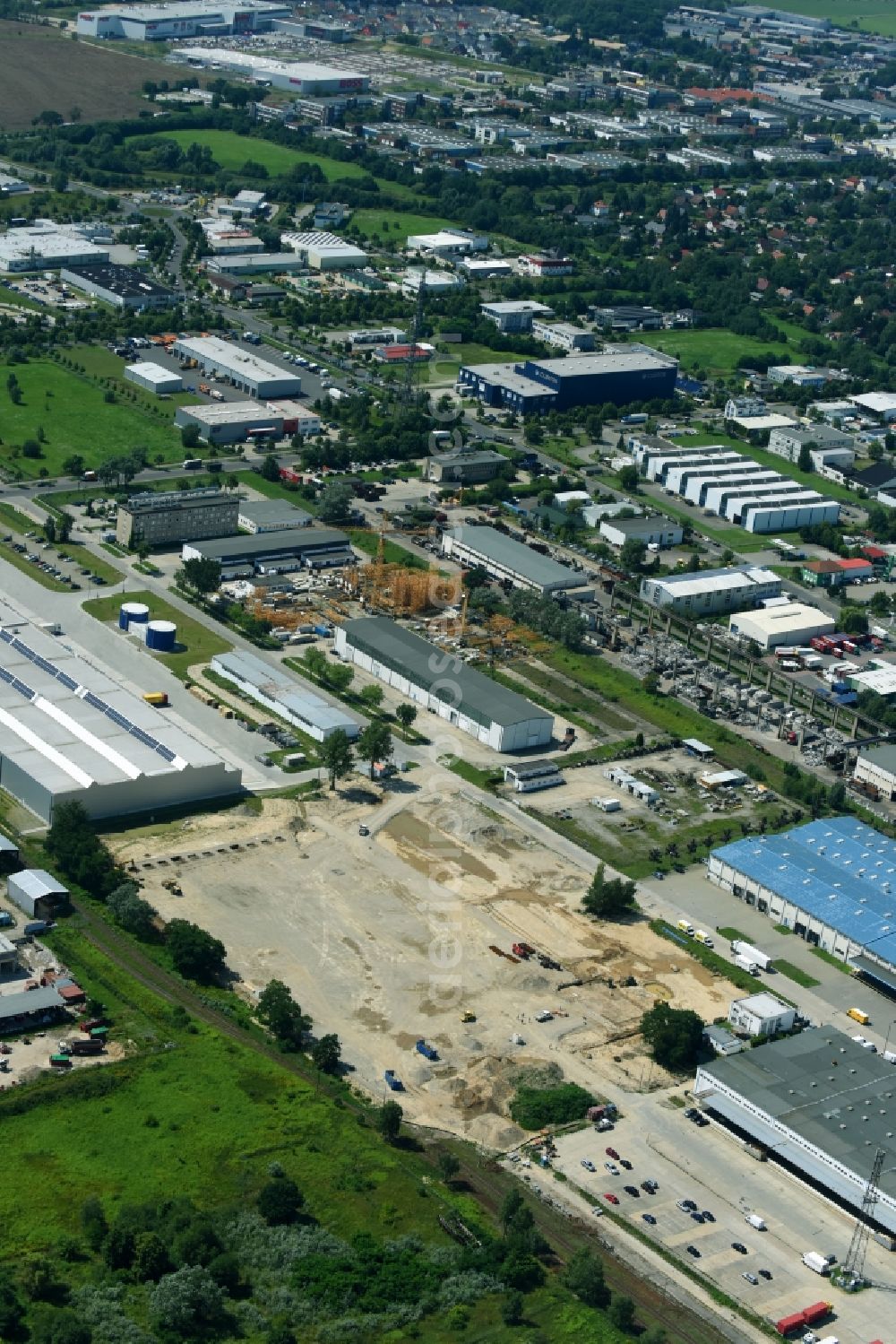 Hoppegarten from the bird's eye view: Construction site to build a new building complex on the site of the logistics center of Rhenus Home Delivery GmbH in the district Dahlwitz-Hoppegarten in Hoppegarten in the state Brandenburg, Germany