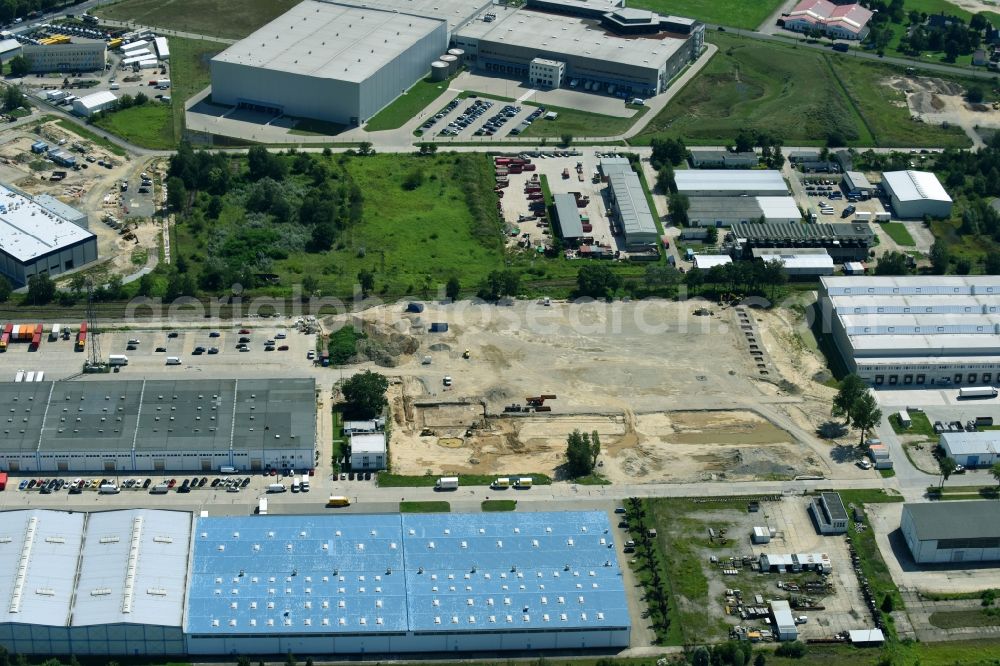 Hoppegarten from above - Construction site to build a new building complex on the site of the logistics center of Rhenus Home Delivery GmbH in the district Dahlwitz-Hoppegarten in Hoppegarten in the state Brandenburg, Germany