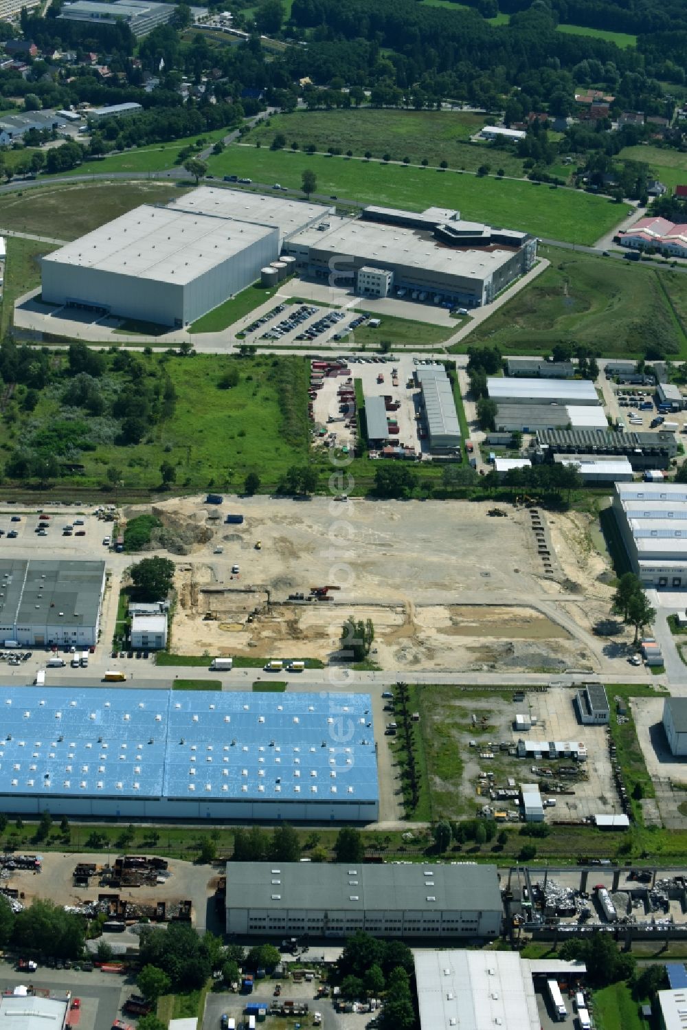 Hoppegarten from the bird's eye view: Construction site to build a new building complex on the site of the logistics center of Rhenus Home Delivery GmbH in the district Dahlwitz-Hoppegarten in Hoppegarten in the state Brandenburg, Germany