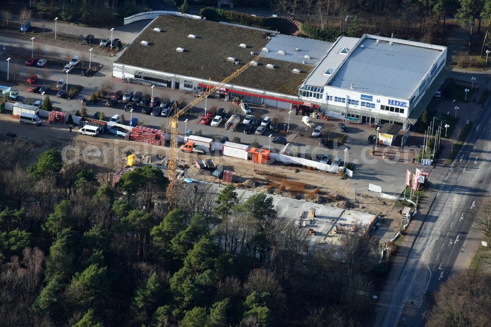 Hohen Neuendorf from the bird's eye view: Construction works of the shopping center at the former OBI - Hardware at Schoenfliesser street in Hohen Neuendorf in Brandenburg. GVG Project Development Company plans to revitalize the brain area by demolition of disused construction market and the new Spacious a modern local supply and service center