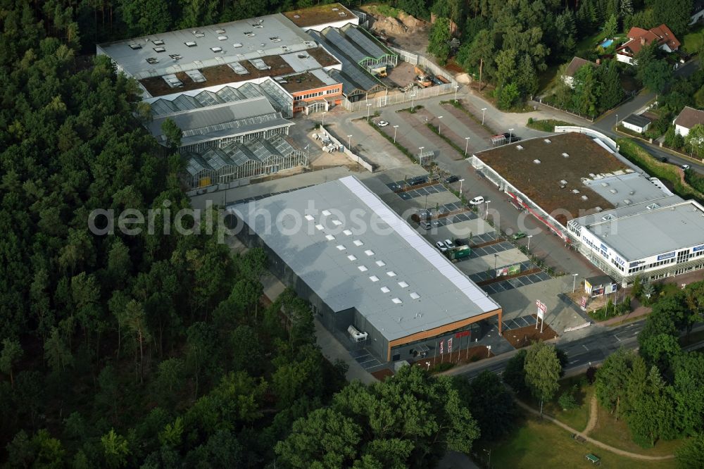 Hohen Neuendorf from above - Construction works of the shopping center at the former OBI - Hardware at Schoenfliesser street in Hohen Neuendorf in Brandenburg. GVG Project Development Company plans to revitalize the brain area by demolition of disused construction market and the new Spacious a modern local supply and service center