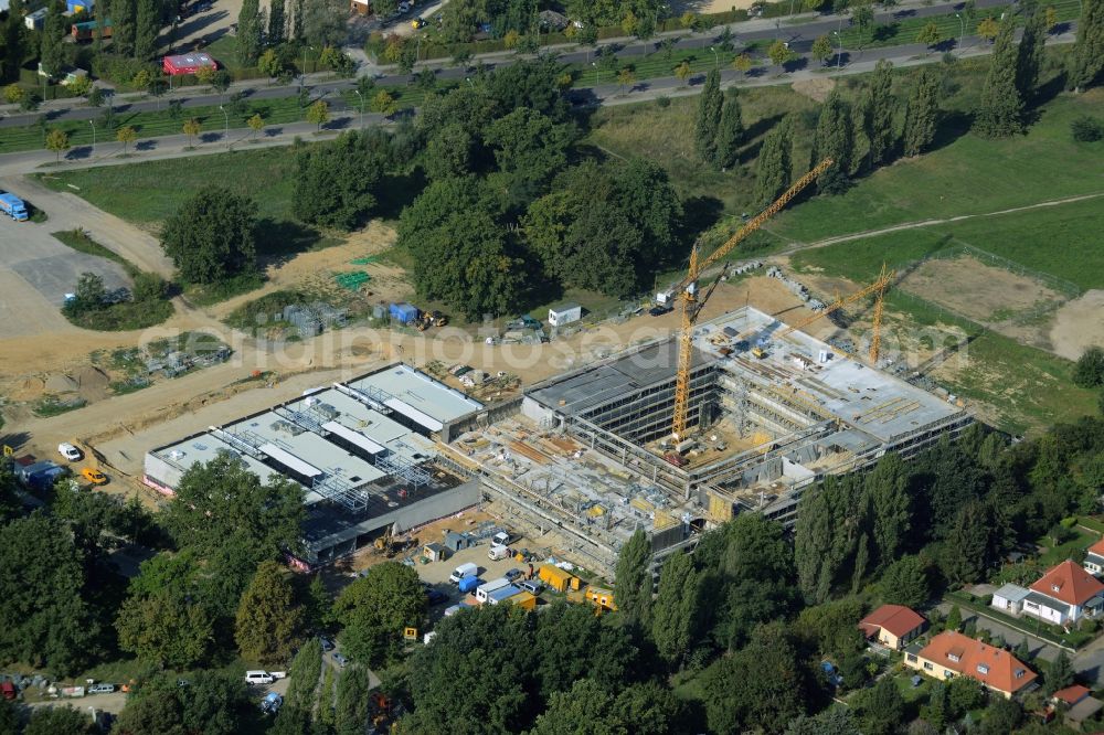 Potsdam from above - Construction site for the new building of Leonardo-Da-Vinci school on Esplanade street in Potsdam in the state of Brandenburg. The school is being built on Bornstedter Feld on site of the former federal garden show BUGA and opposite the Biospaehre Potsdam area