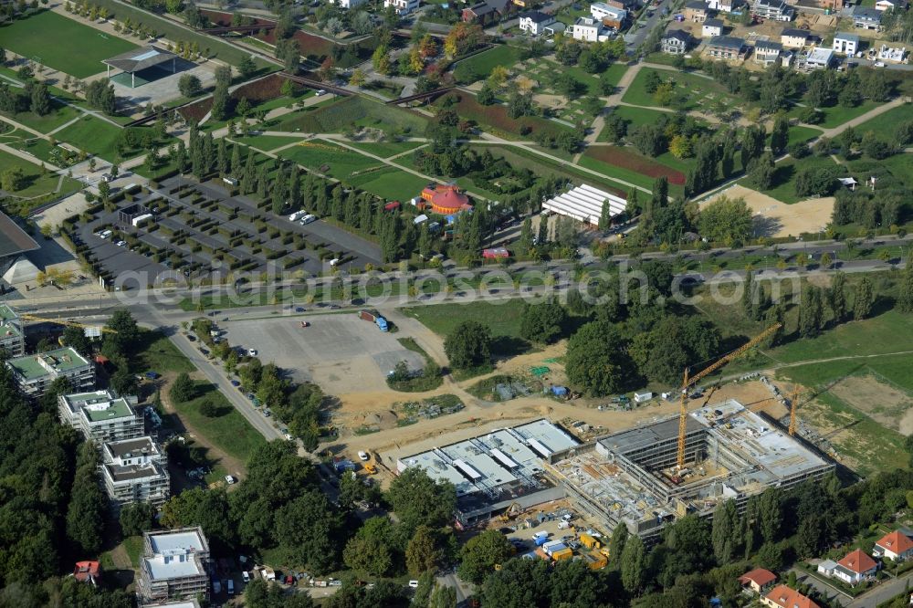 Potsdam from the bird's eye view: Construction site for the new building of Leonardo-Da-Vinci school on Esplanade street in Potsdam in the state of Brandenburg. The school is being built on Bornstedter Feld on site of the former federal garden show BUGA and opposite the Biospaehre Potsdam area