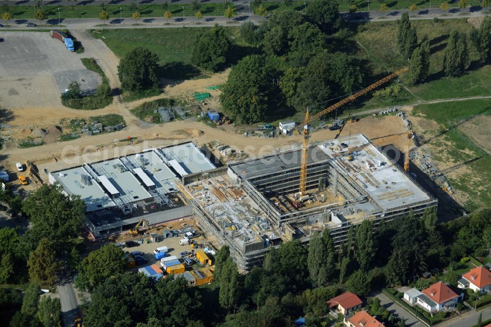 Aerial photograph Potsdam - Construction site for the new building of Leonardo-Da-Vinci school on Esplanade street in Potsdam in the state of Brandenburg. The school is being built on Bornstedter Feld on site of the former federal garden show BUGA and opposite the Biospaehre Potsdam area