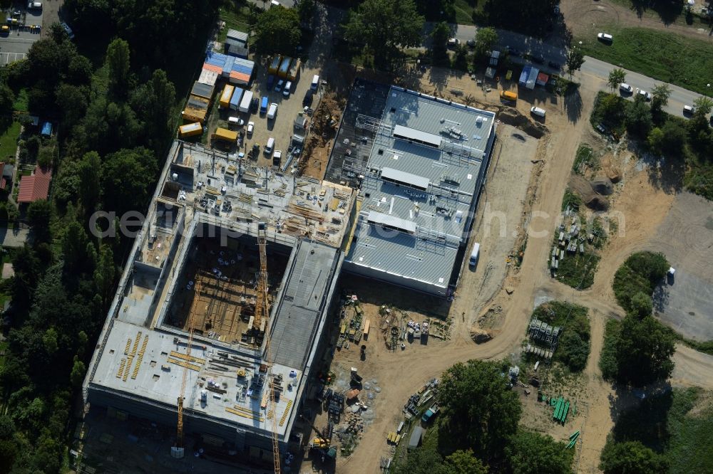 Potsdam from above - Construction site for the new building of Leonardo-Da-Vinci school on Esplanade street in Potsdam in the state of Brandenburg. The school is being built on Bornstedter Feld on site of the former federal garden show BUGA and opposite the Biospaehre Potsdam area