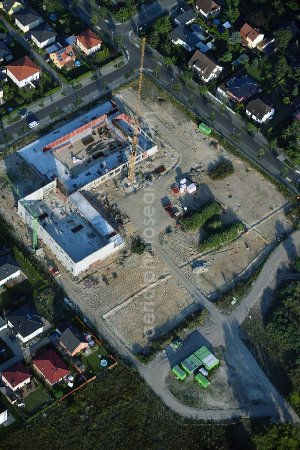 Berlin from the bird's eye view: Construction site of a primary school on Habichtshorst in the Biesdorf part of the district of Marzahn-Hellersdorf in Berlin. The premises will include a sports arena and a schoolyard and was developed by the architectural company ReimarHerbst