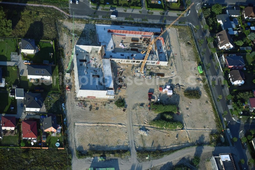 Berlin from above - Construction site of a primary school on Habichtshorst in the Biesdorf part of the district of Marzahn-Hellersdorf in Berlin. The premises will include a sports arena and a schoolyard and was developed by the architectural company ReimarHerbst