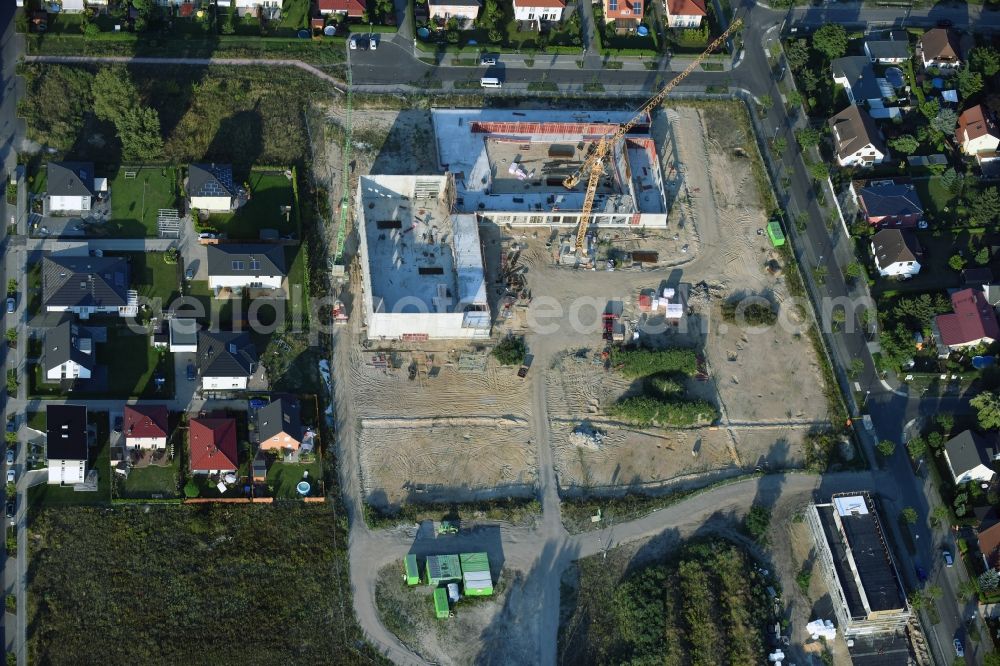 Berlin from above - Construction site of a primary school on Habichtshorst in the Biesdorf part of the district of Marzahn-Hellersdorf in Berlin. The premises will include a sports arena and a schoolyard and was developed by the architectural company ReimarHerbst