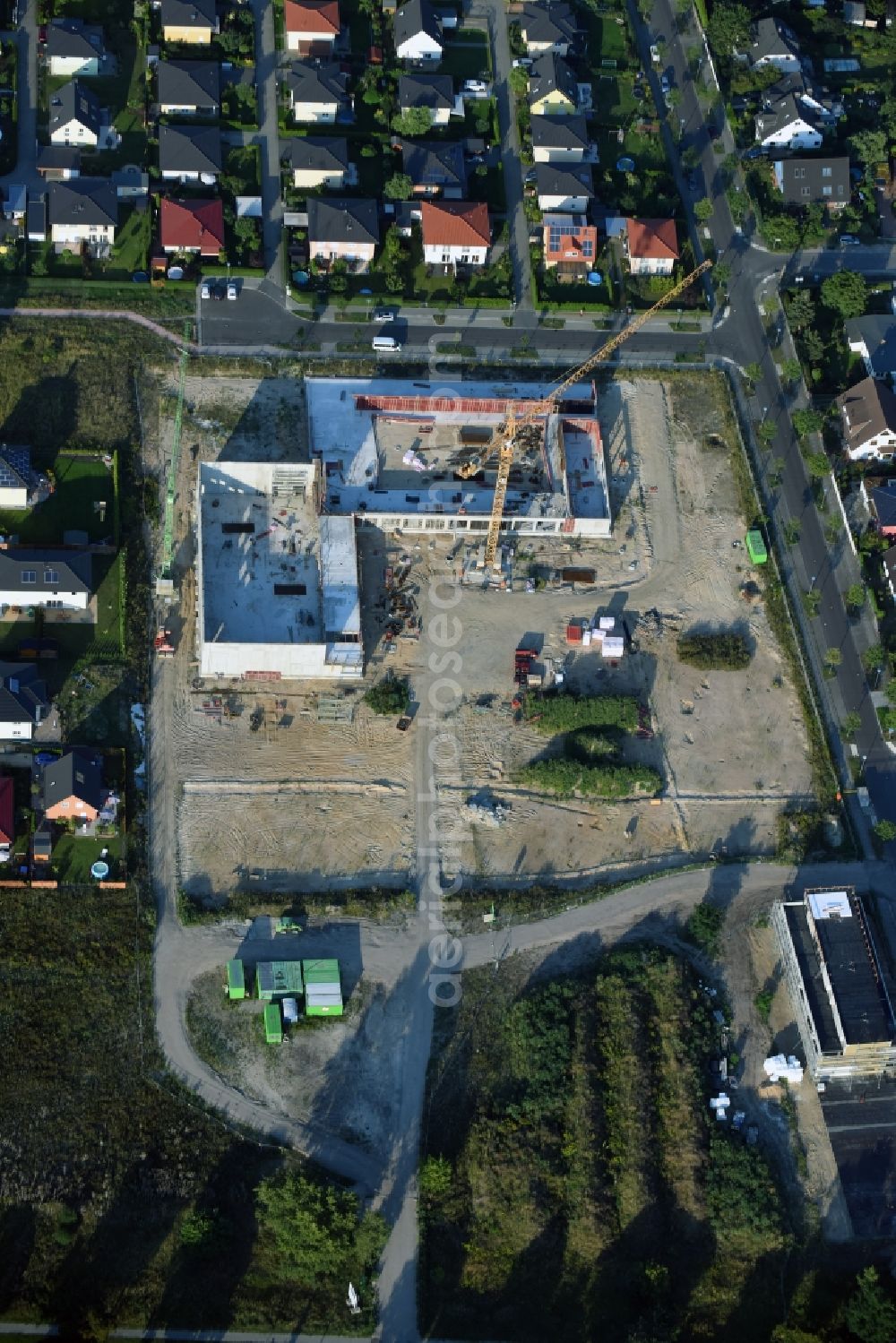 Berlin from the bird's eye view: Construction site of a primary school on Habichtshorst in the Biesdorf part of the district of Marzahn-Hellersdorf in Berlin. The premises will include a sports arena and a schoolyard and was developed by the architectural company ReimarHerbst