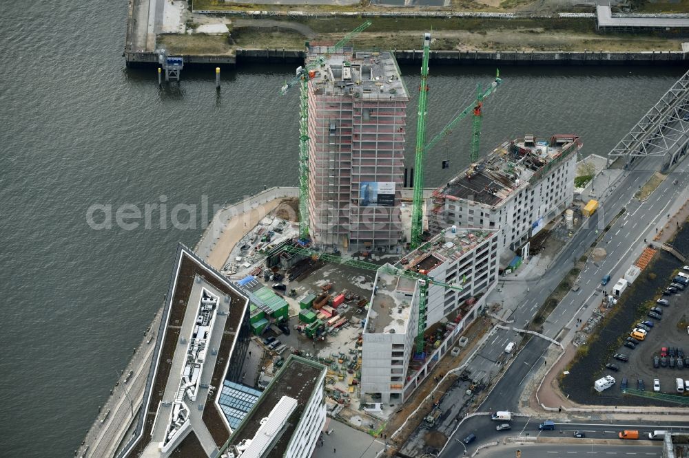 Hamburg from the bird's eye view: Construction site for new high-rise building complex des Buero- und Geschaeftshauses WATERMARK der IQ Tower GmbH & Co. KG in the district HafenCity in Hamburg. A joint project of STRABAG Real Estate GmbH and ECE Projektmanagement G.m.b.H. & Co. KG and BAM Deutschland AG