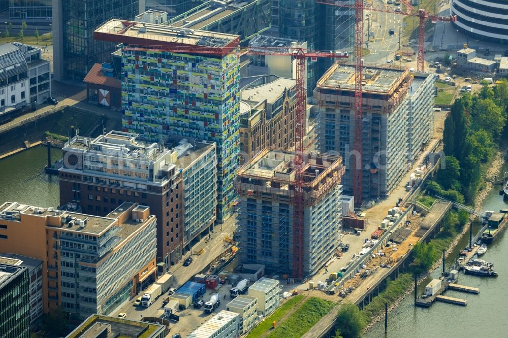 Aerial image Düsseldorf - Construction site for new high-rise building complex Duesseldorfer Heimathafen in of Speditionstrasse in Duesseldorf in the state North Rhine-Westphalia, Germany