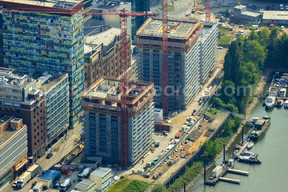 Aerial photograph Düsseldorf - Construction site for new high-rise building complex Duesseldorfer Heimathafen in of Speditionstrasse in Duesseldorf in the state North Rhine-Westphalia, Germany