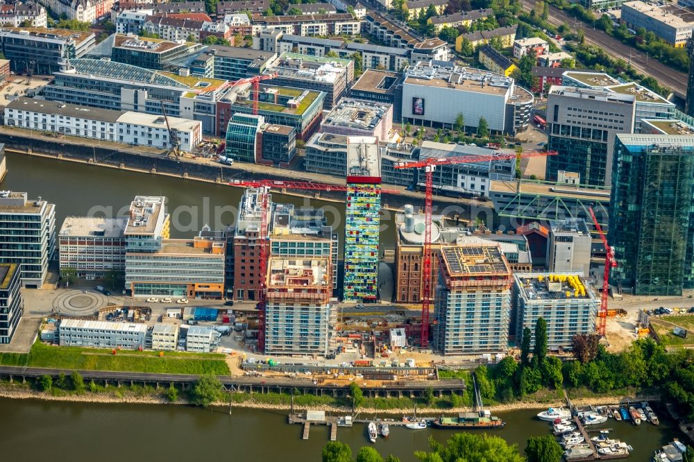 Düsseldorf from the bird's eye view: Construction site for new high-rise building complex Duesseldorfer Heimathafen in of Speditionstrasse in Duesseldorf in the state North Rhine-Westphalia, Germany