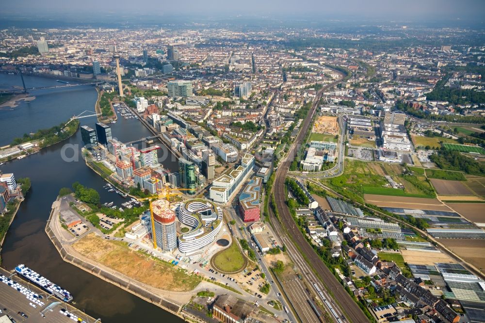 Düsseldorf from above - Construction site for new high-rise building complex Duesseldorfer Heimathafen in of Speditionstrasse in Duesseldorf in the state North Rhine-Westphalia, Germany