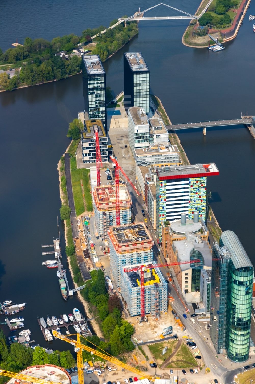 Düsseldorf from the bird's eye view: Construction site for new high-rise building complex Duesseldorfer Heimathafen in of Speditionstrasse in Duesseldorf in the state North Rhine-Westphalia, Germany