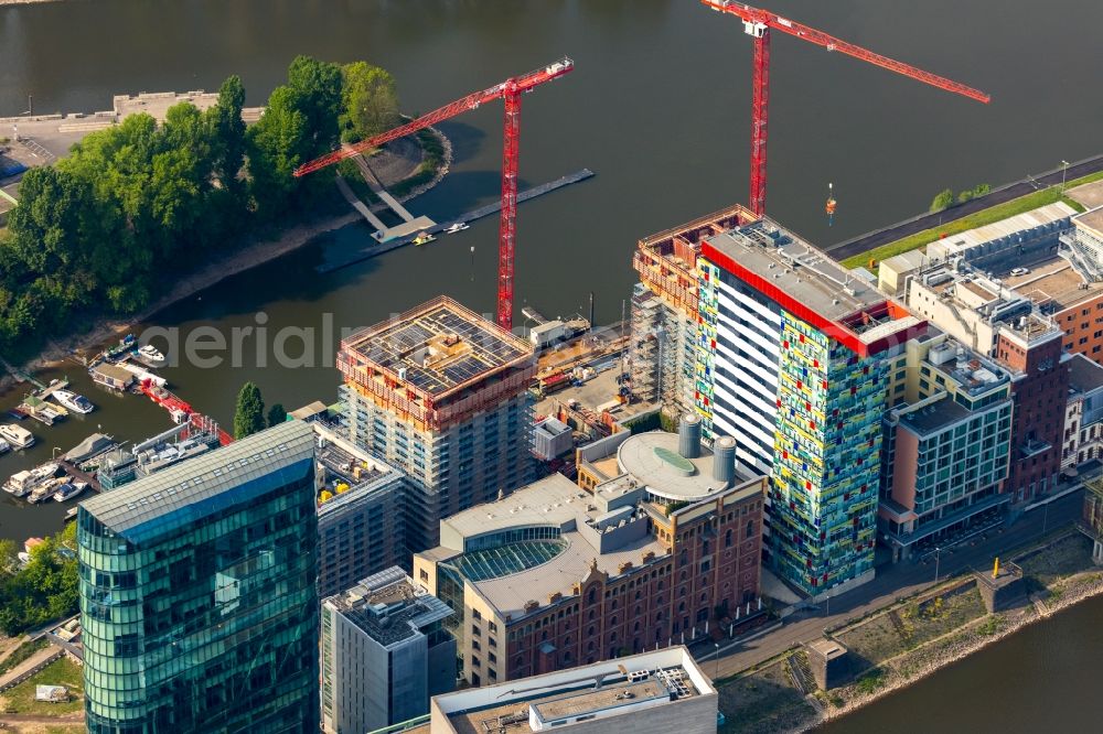 Düsseldorf from above - Construction site for new high-rise building complex Duesseldorfer Heimathafen in of Speditionstrasse in Duesseldorf in the state North Rhine-Westphalia, Germany