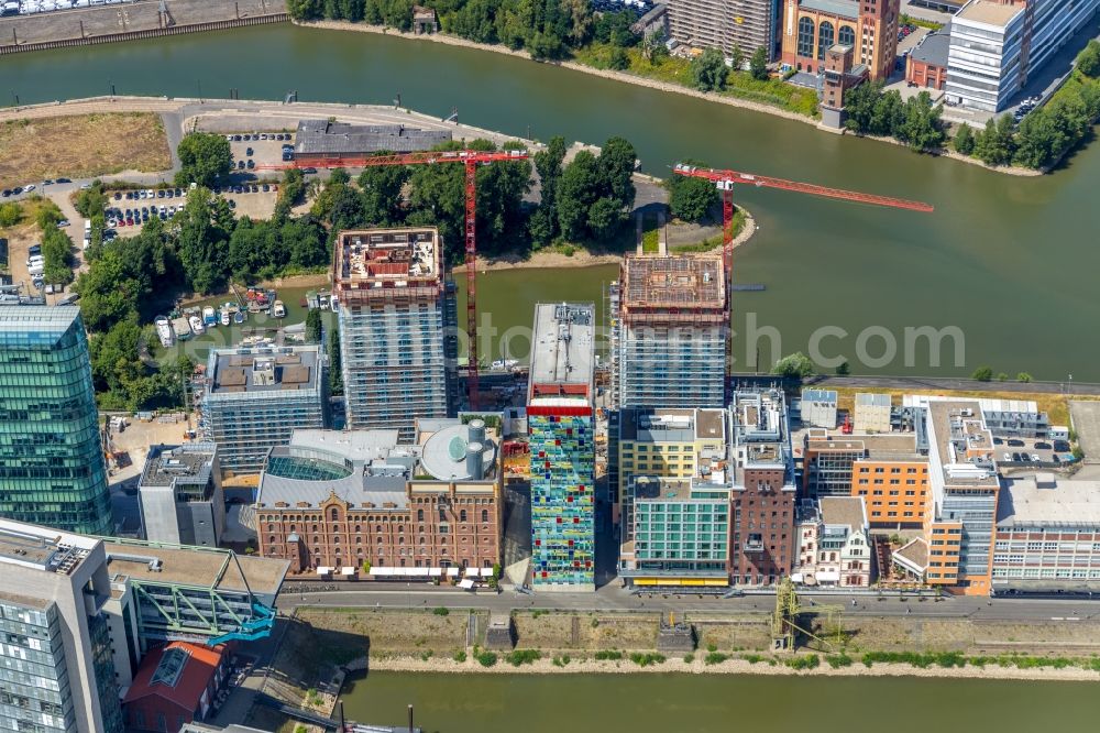 Düsseldorf from above - Construction site for new high-rise building complex Duesseldorfer Heimathafen in of Speditionstrasse in Duesseldorf in the state North Rhine-Westphalia, Germany