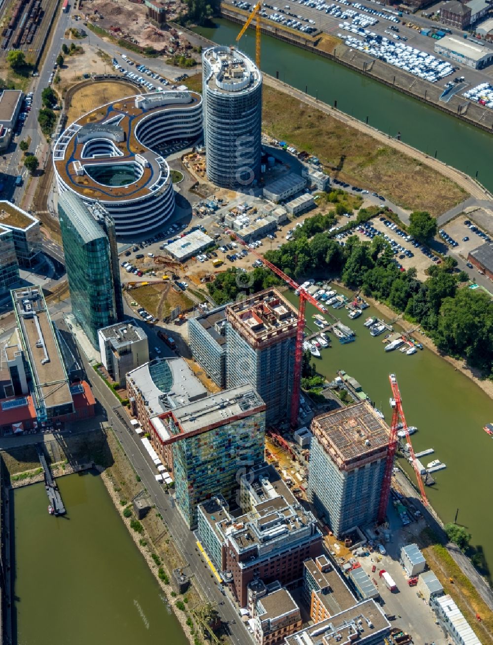 Düsseldorf from the bird's eye view: Construction site for new high-rise building complex Duesseldorfer Heimathafen in of Speditionstrasse in Duesseldorf in the state North Rhine-Westphalia, Germany