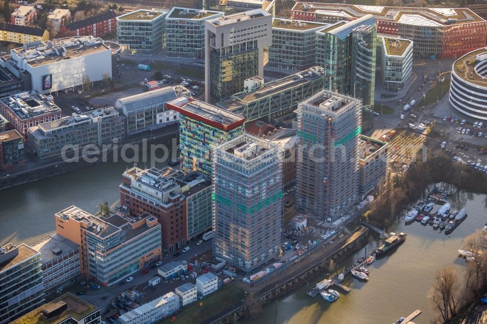 Düsseldorf from the bird's eye view: Construction site for new high-rise building complex Duesseldorfer Heimathafen in of Speditionstrasse in Duesseldorf in the state North Rhine-Westphalia, Germany