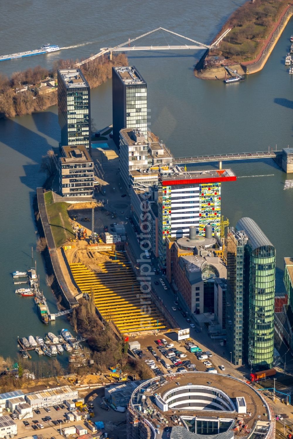 Düsseldorf from the bird's eye view: Construction site for new high-rise building complex Duesseldorfer Heimathafen in of Speditionstrasse in Duesseldorf in the state North Rhine-Westphalia, Germany