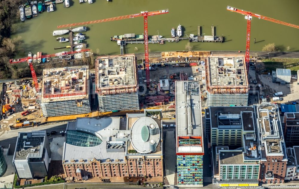 Düsseldorf from the bird's eye view: Construction site for new high-rise building complex Duesseldorfer Heimathafen in of Speditionstrasse in Duesseldorf in the state North Rhine-Westphalia, Germany