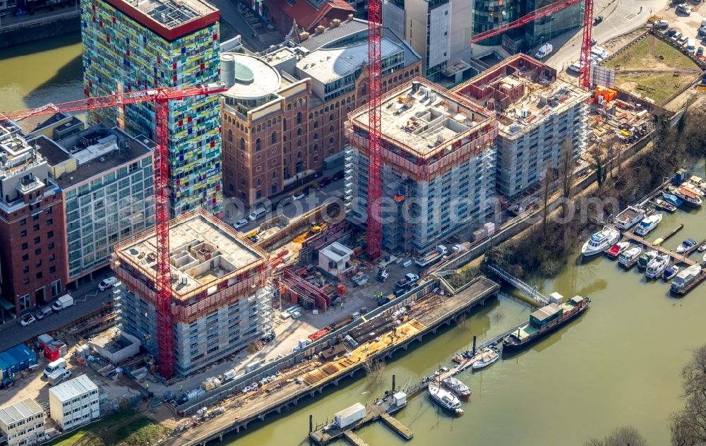 Düsseldorf from the bird's eye view: Construction site for new high-rise building complex Duesseldorfer Heimathafen in of Speditionstrasse in Duesseldorf in the state North Rhine-Westphalia, Germany