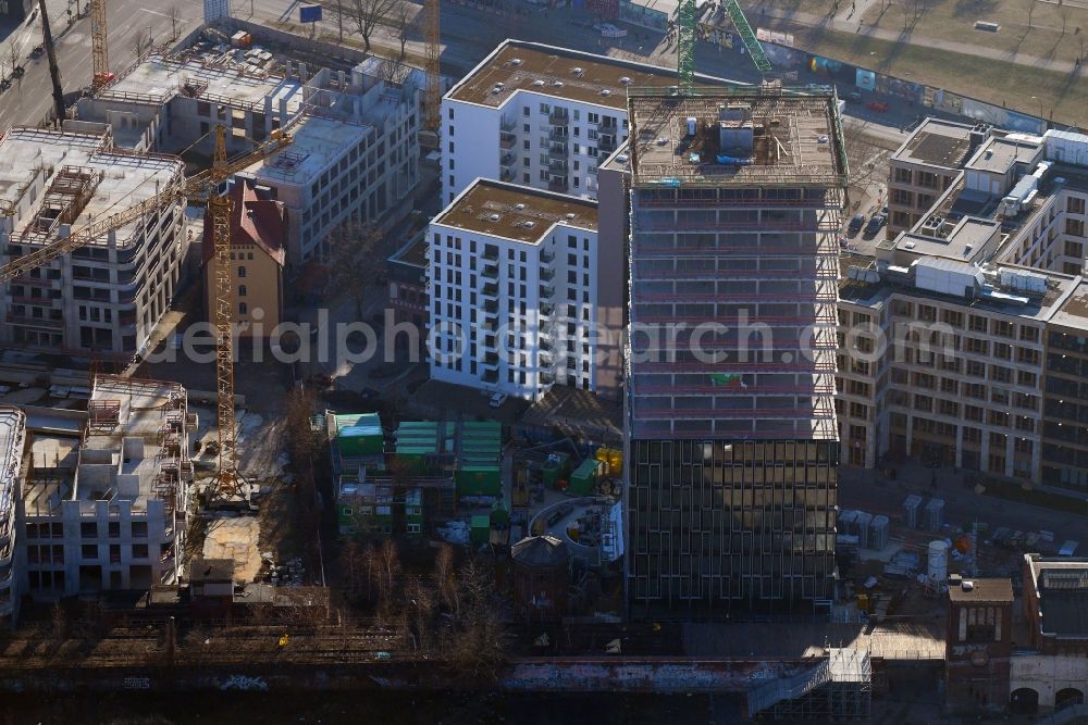 Berlin from the bird's eye view: Construction site for new high-rise building complex Hochhaus on Postbahnhof in the district Friedrichshain in Berlin, Germany