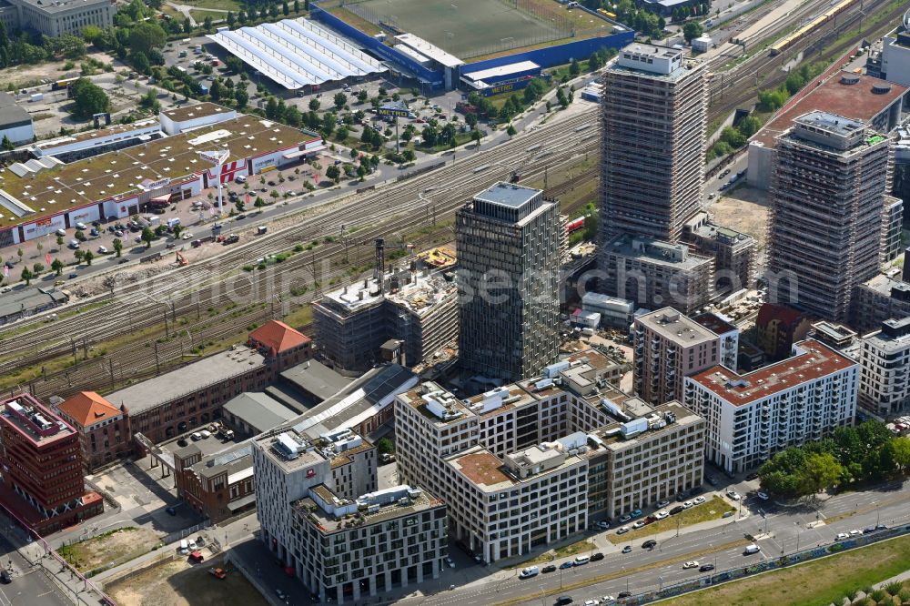 Berlin from the bird's eye view: Construction site for new high-rise building complex Max & Moritz on Rummelsburger Platz - Marianne-von-Rantzau-Strasse on street Muehlenstrasse in the district Friedrichshain in Berlin, Germany