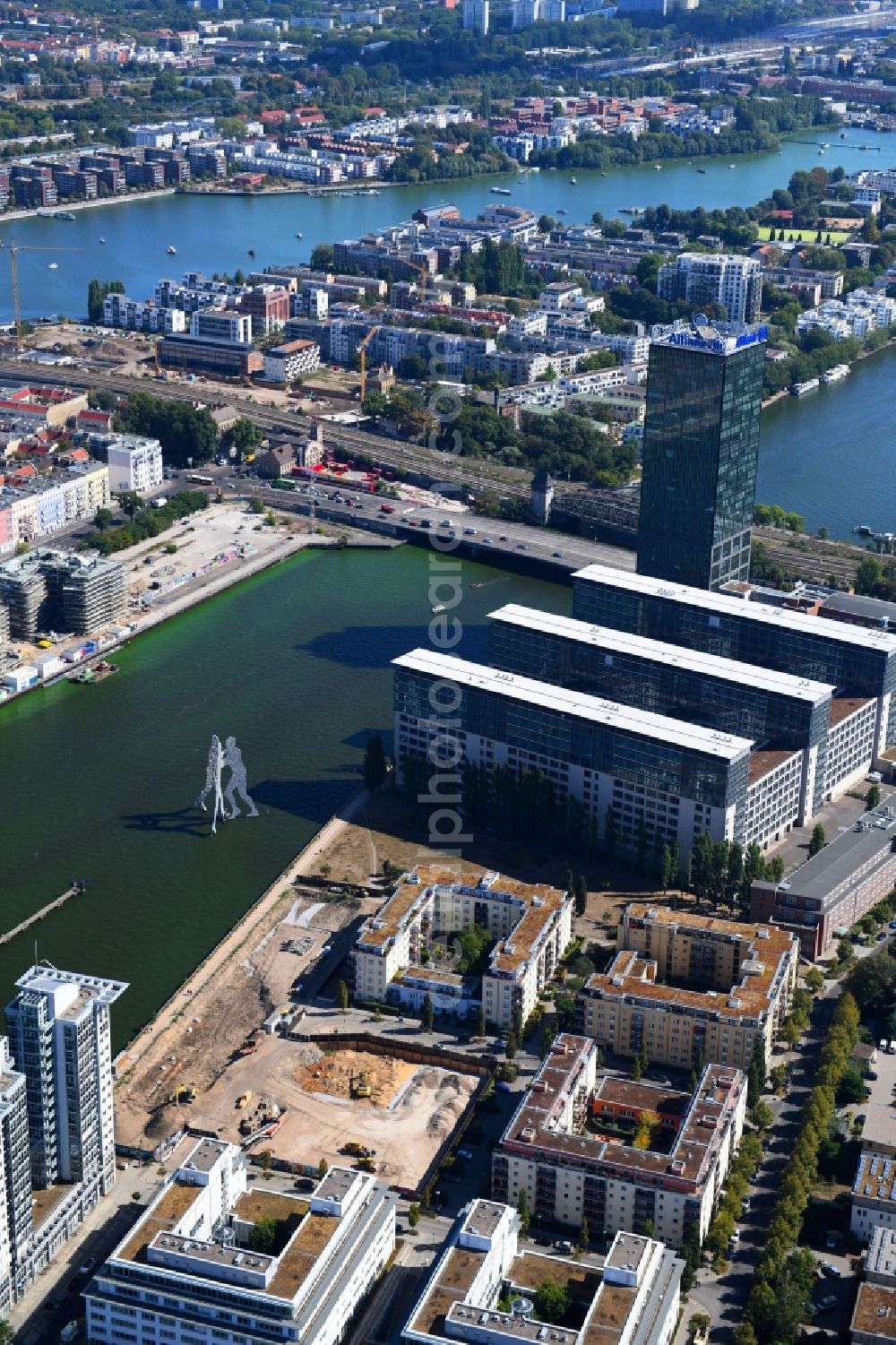 Berlin from the bird's eye view: Construction site for new high-rise building complex on river site of Spree along the Fanny-Zobel-Strasse in the district Treptow in Berlin, Germany