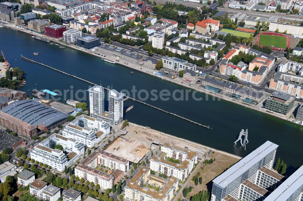 Berlin from the bird's eye view: Construction site for new high-rise building complex on river site of Spree along the Fanny-Zobel-Strasse in the district Treptow in Berlin, Germany