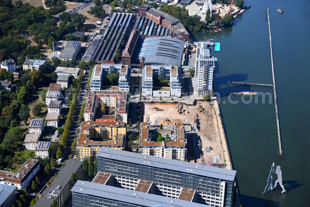 Berlin from the bird's eye view: Construction site for new high-rise building complex on river site of Spree along the Fanny-Zobel-Strasse in the district Treptow in Berlin, Germany