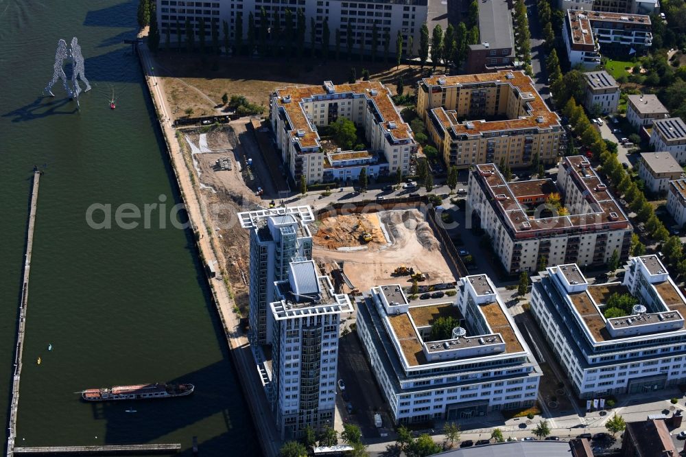 Berlin from the bird's eye view: Construction site for new high-rise building complex on river site of Spree along the Fanny-Zobel-Strasse in the district Treptow in Berlin, Germany