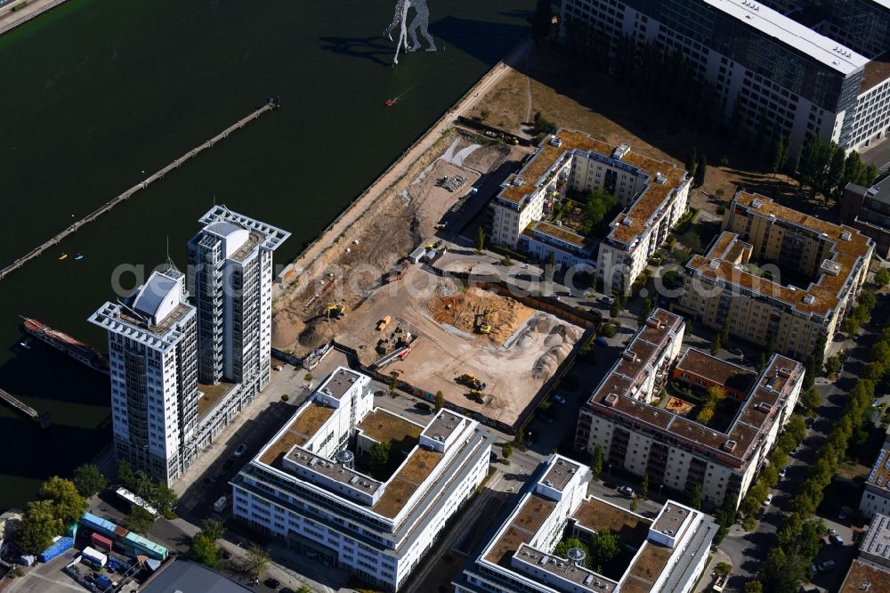 Berlin from the bird's eye view: Construction site for new high-rise building complex on river site of Spree along the Fanny-Zobel-Strasse in the district Treptow in Berlin, Germany