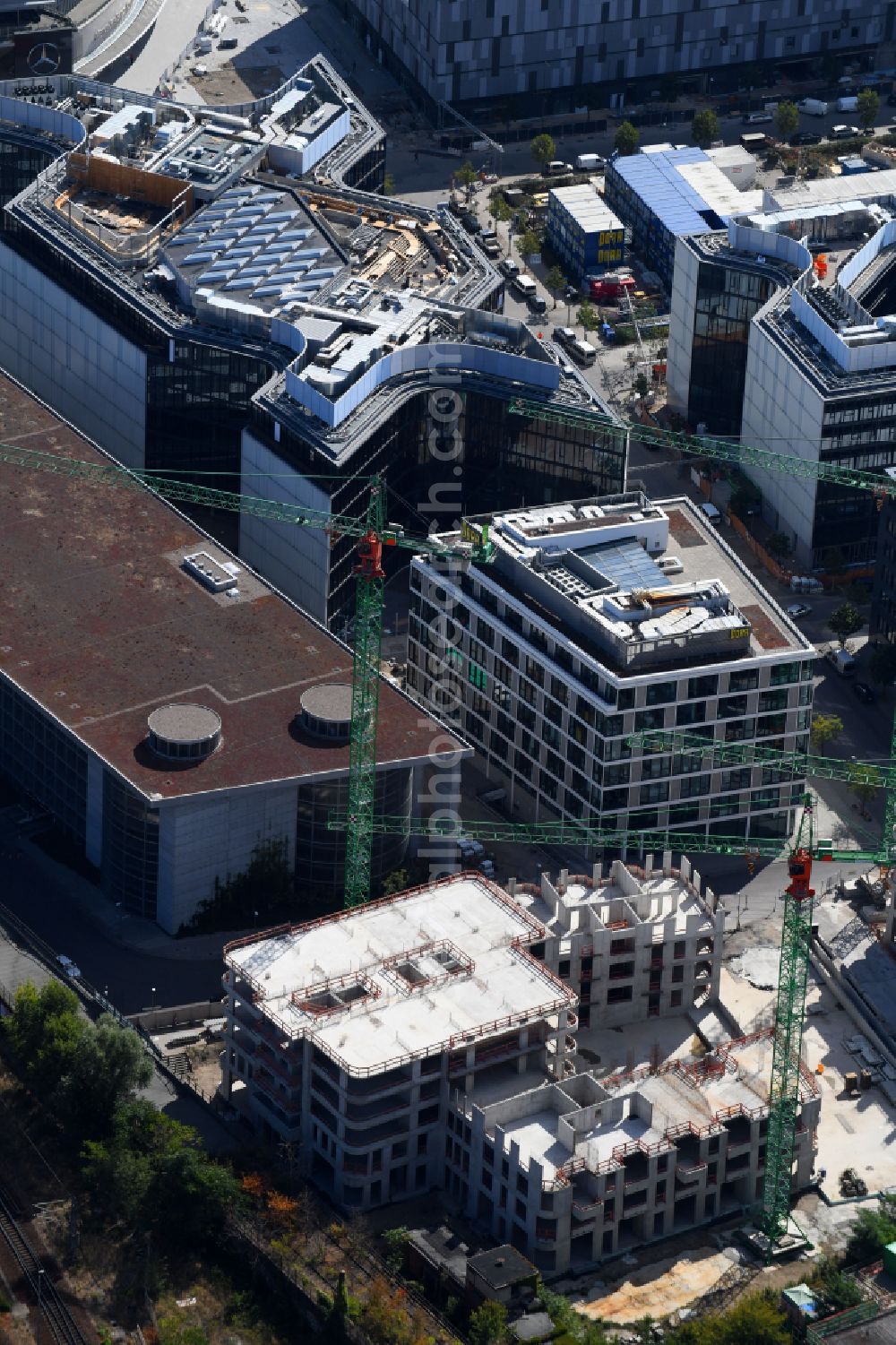 Aerial image Berlin - Construction site for the new skyscraper ensemble Max und Moritz Quartier - UPSIDE BERLIN with residential and commercial units by the company DIE WOHNKOMPANIE Berlin GmbH and the architecture office Noefer Gesellschaft von Architekten mbH on Mariane-von-Rantzau-Strasse in the district Friedrichshain in Berlin, Germany