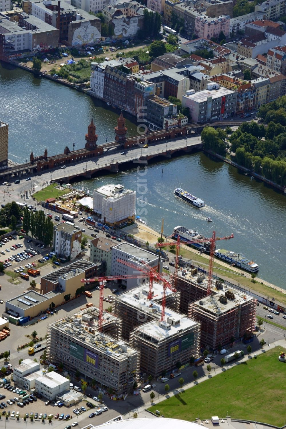 Berlin from the bird's eye view: Construction site to build a new hotel and office campus on the Anschutz area in the district of Friedrichshain in Berlin. Porr Solutions Germany GmbH is the owner and developer of the property