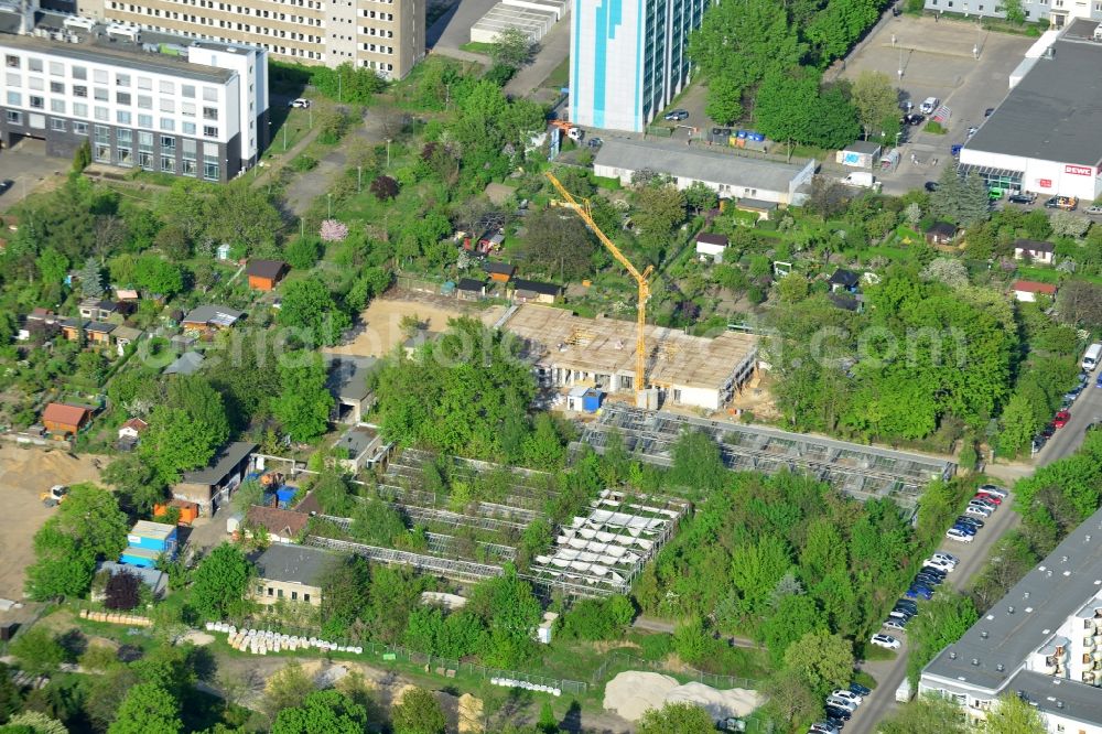 Berlin from the bird's eye view: Construction site for the new building of a youth centre in the Lichtenberg part of Berlin in Germany. The construction site is located on Gotlindestrasse amidst allotments and was designed by the architectural office Kersten+Kopp