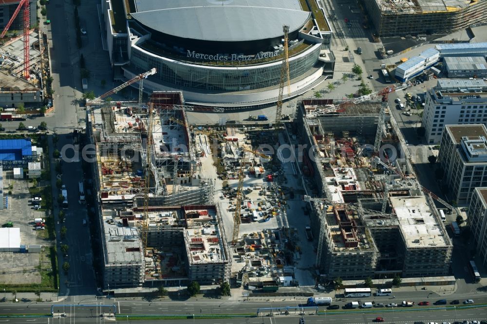 Berlin from the bird's eye view: Construction site for the new building eines Kino- Freizeit- and Hotelkomplexes on Anschutz- Areal along of Muehlenstrasse in the district Bezirk Friedrichshain-Kreuzberg in Berlin, Germany