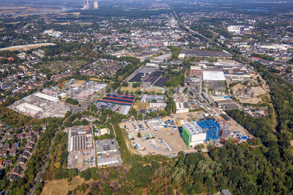 Aerial photograph Dinslaken - Construction site of power plants and exhaust towers of thermal power station DHE - Dinslakener Holz-Energiezentrum in Dinslaken at Ruhrgebiet in the state North Rhine-Westphalia, Germany