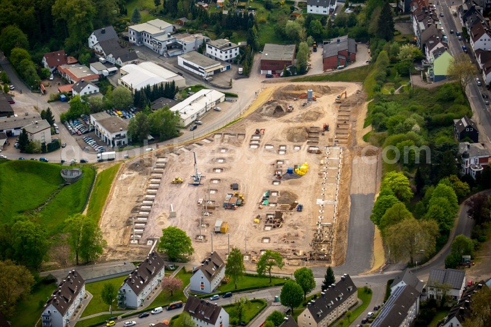 Ennepetal from the bird's eye view: Construction site of new production and storage facilities on Gewerbestrasse in Ennepetal in the state of North Rhine-Westphalia. The former site of Car August Bauer will be used by febi bilstein