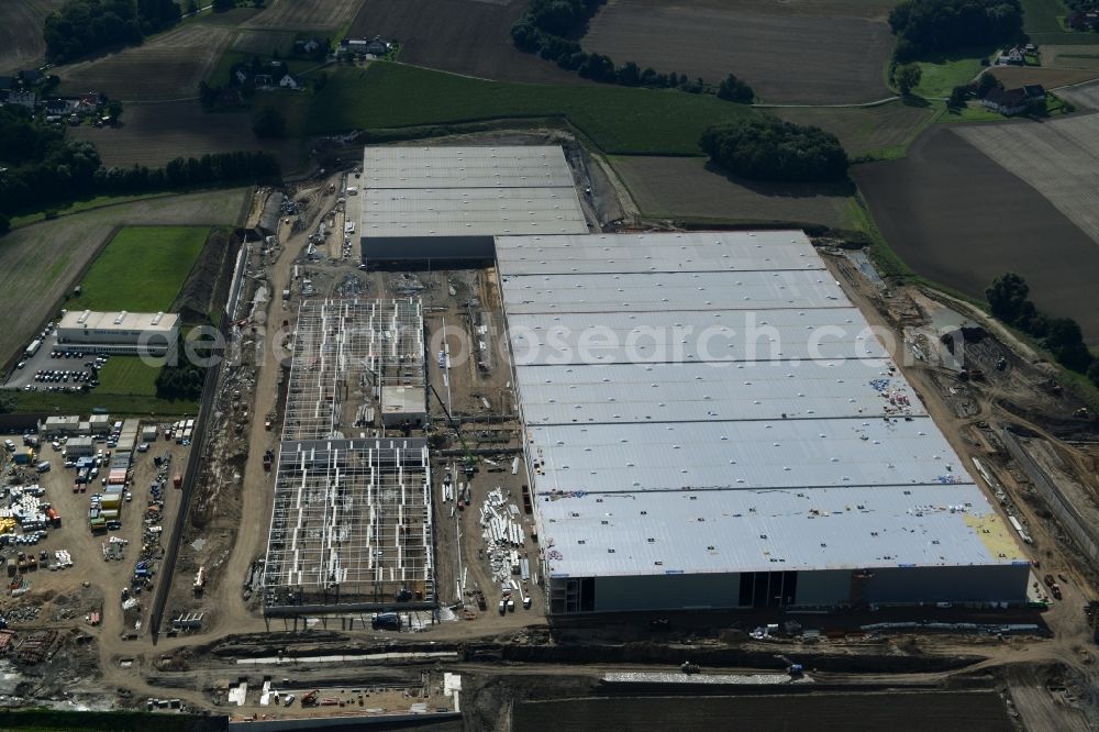 Aerial photograph Löhne - Construction site for the new building the logistics center of Hermes Fulfilment in the industrial area Scheid Kamp in Loehne in the state North Rhine-Westphalia. Under the project leadership of the ECE Projektmanagement GmbH & Co. KG erected the construction company GOLDBECK GmbH the logistics hall complex