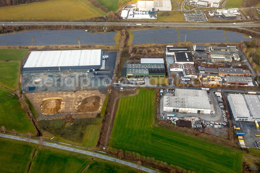 Meschede from above - Construction site to build a new building complex on the site of the logistics center of Briloner Leuchten GmbH & Co. KG Am Steinbach in Meschede in the state North Rhine-Westphalia, Germany