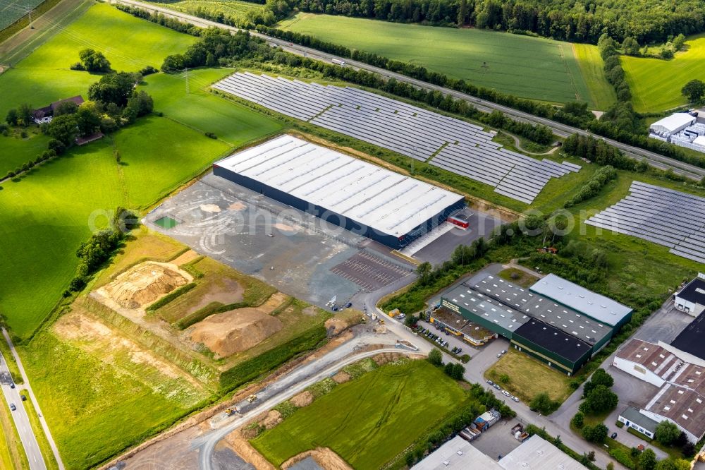 Meschede from the bird's eye view: Construction site to build a new building complex on the site of the logistics center of Briloner Leuchten GmbH & Co. KG Am Steinbach in Meschede in the state North Rhine-Westphalia, Germany